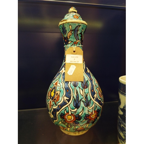 6 - A Persian pottery blue vase and cover A/F
