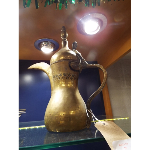 75 - An old Turkish brass coffee pot with long spout