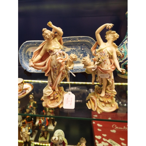 8 - A pair of Meissen porcelain figurines females with cherubs, both A/F