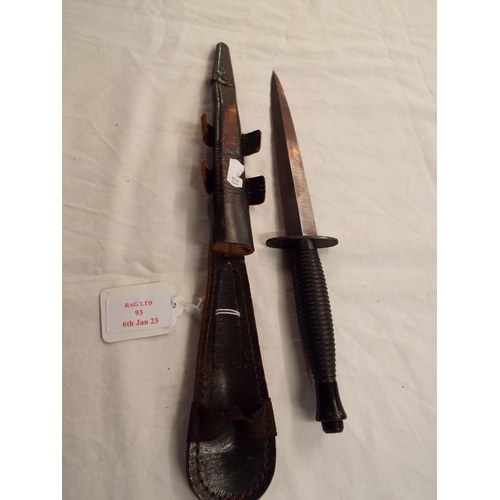 93 - A post-war British Fairburn commando dagger in leather scabbard