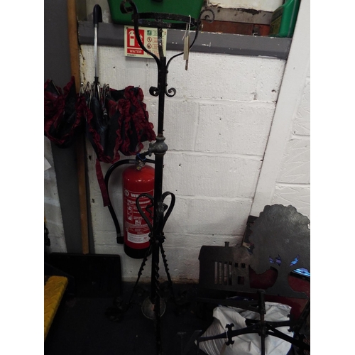 A vintage wrought iron brass oil lamp holder