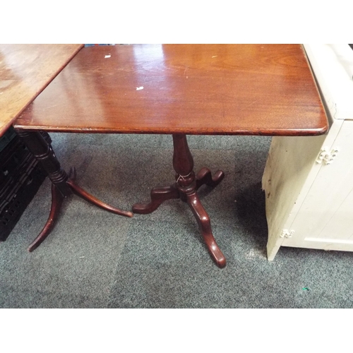 559 - A mahogany oblong snap top side table resting on tri-form base