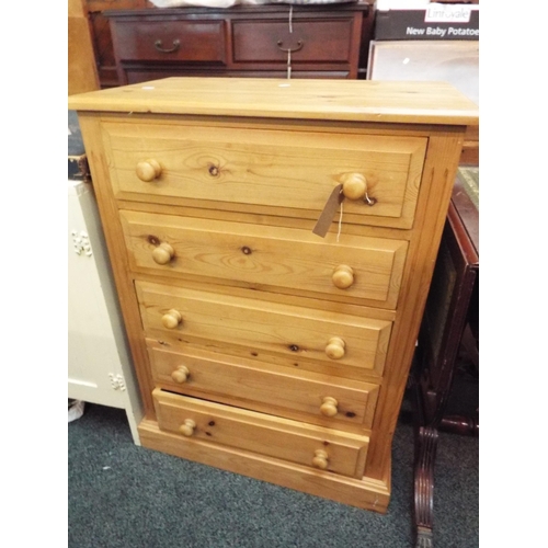 563 - A pine chest of five long drawers