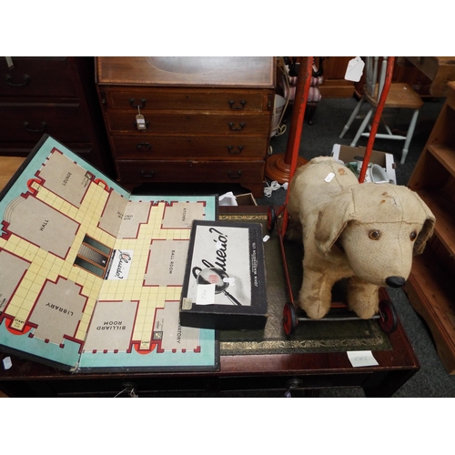 564 - A vintage Chiltern plush push along dog and games