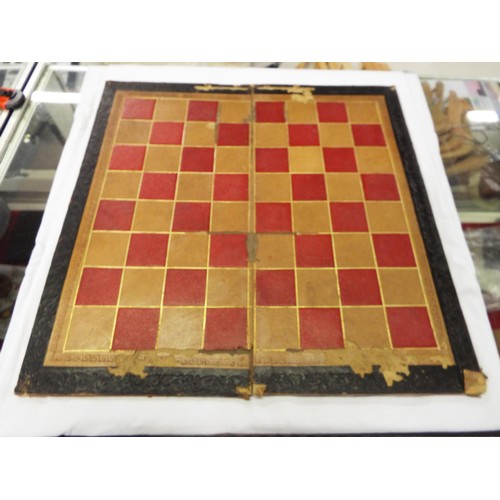 168 - A vintage leather chess board and a circa late 19thC mahogany chess piece box with original Staunton... 