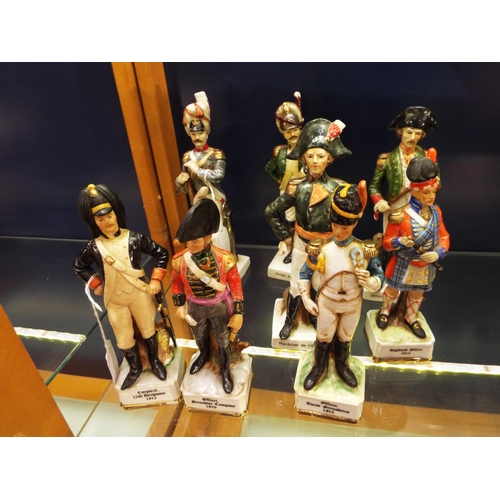 12 - Eight porcelain military figures to include 'Grenadierde la Garde', 'Soldat d'Infanterie', 'Officer ... 