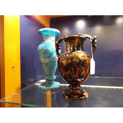 17 - A Victorian brown glazed china vase with rope twist handles together with a blue marble type vase