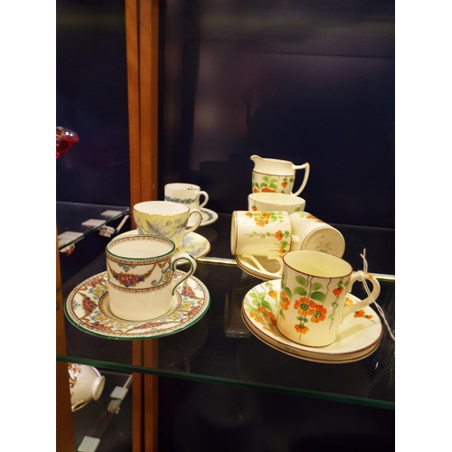 38 - A part Radfords coffee set together with three Wedgwood coffee cans and saucers