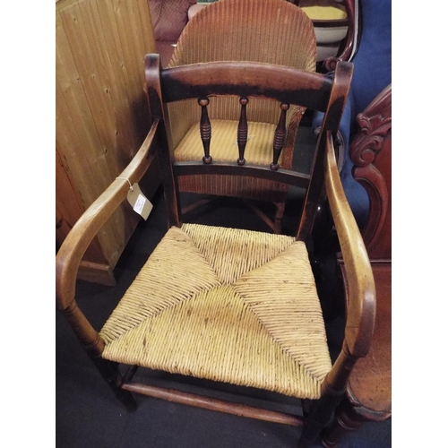 A farmhouse spindle back carver chair