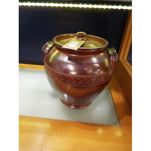 55 - A brown salt glaze storage jar with lid