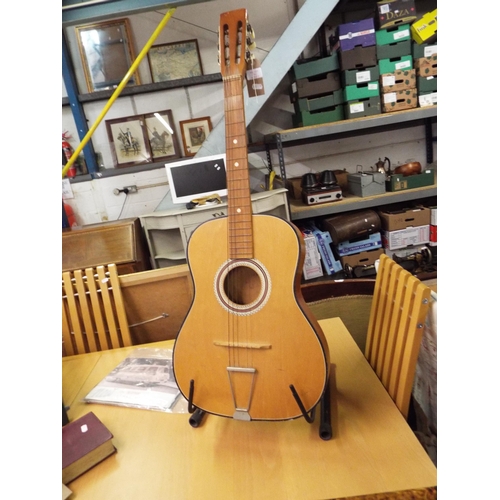 532 - An acoustic guitar and stand