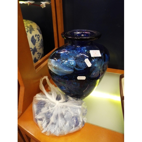 64 - A large cobalt blue studio art glass vase having glass beads and sea shells inside etc