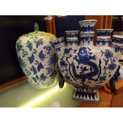 76 - A large Chinese blue and white lidded pot having leaf decoration together with a blue and white tuli... 