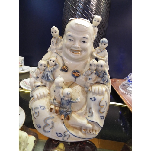 89 - A large Leonardo Collection blue and white Buddha and children