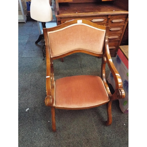 611 - A walnut metamorphic prayer chair with salmon pink upholstery