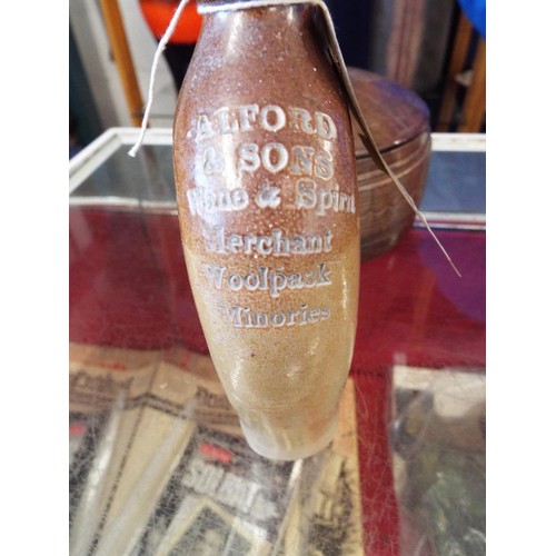 113 - A leather tooled round box with lid together with a stoneware flask shaped bottle, Alford & Sons Woo... 