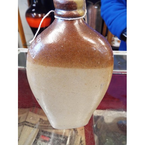 113 - A leather tooled round box with lid together with a stoneware flask shaped bottle, Alford & Sons Woo... 