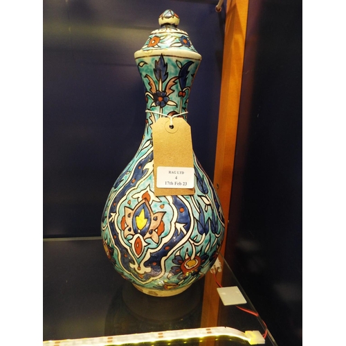 4 - A Persian pottery blue vase and cover A/F