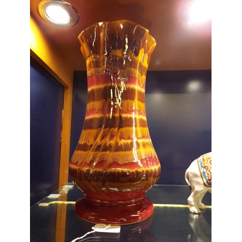 20 - A West German fat lava fluted vase with coloured banding 15 1/2