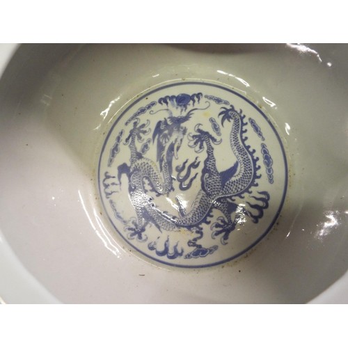 27 - A Chinese blue and white bowl having internal and external dragon decoration with four character mar... 