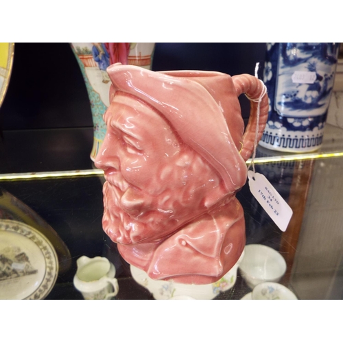 34 - A pink ground Toby jug