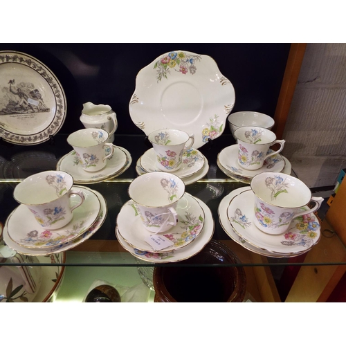 37 - A Spencer Stevenson bone china tea service with floral decoration comprising of cups, saucers, side ... 