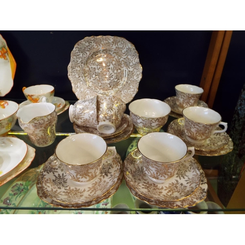 63 - A cream and gilt ground vale tea-set comprising six cups, saucers, side plates, milk jug and sugar b... 