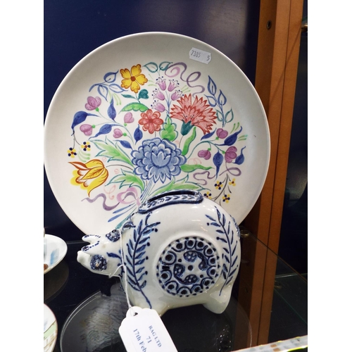 71 - A Poole china plate with a floral design together with a china pig money box