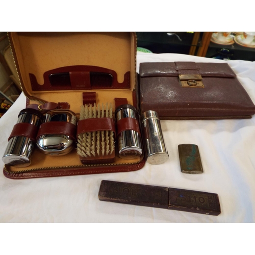 81 - A Gentleman's set in leather case, cut throat razor, lighter and leather stationery wallet