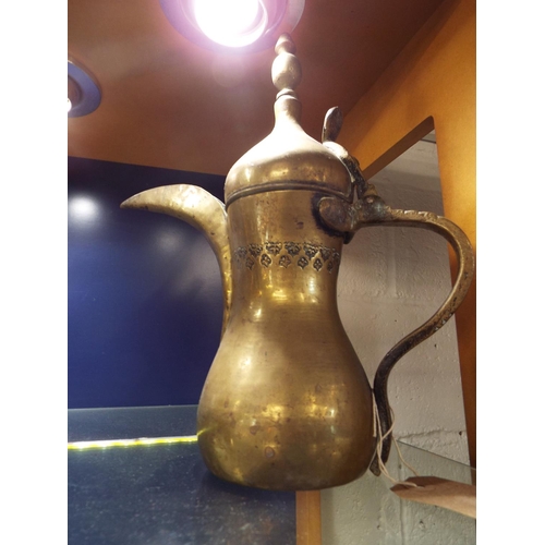 102 - An old Turkish brass coffee pot with long spout