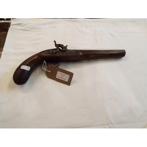 109 - A 19thC percussion pistol with decorated barrel and plates with carved walnut grip