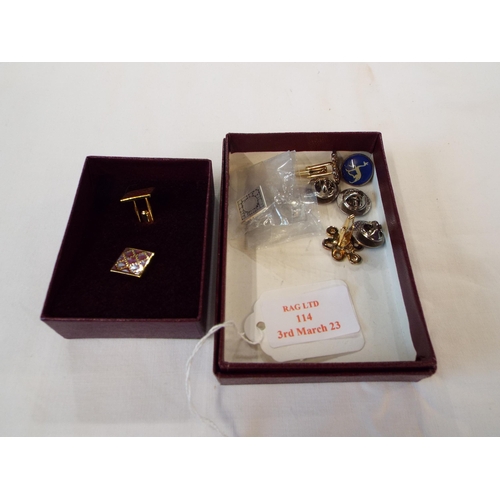 114 - A selection of lapel pins and cuff links