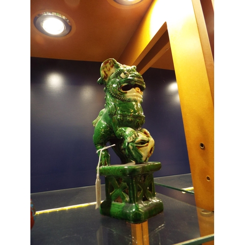 15 - A Chinese pottery green glazed dog of Fu 10