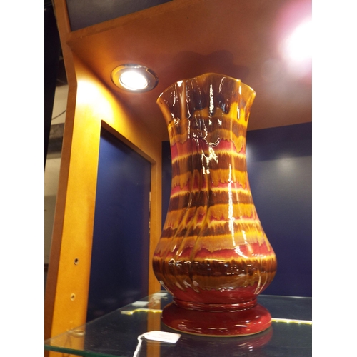 17 - A West German fat lava fluted vase with coloured banding 15 1/2