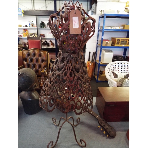 A metal dress stand for display