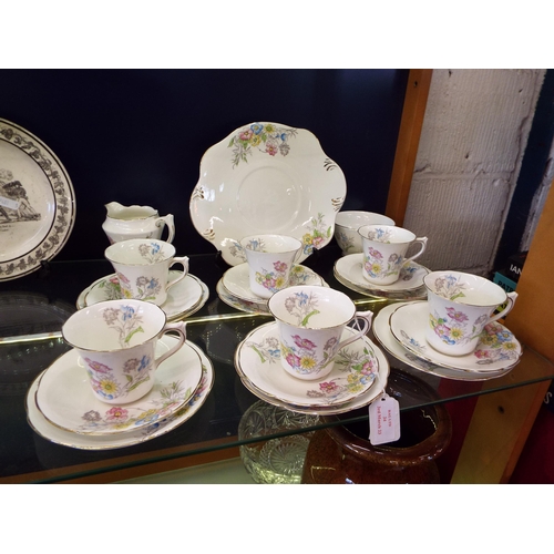 34 - A Spencer Stevenson bone china tea service with floral decoration comprising of cups, saucers, side ... 