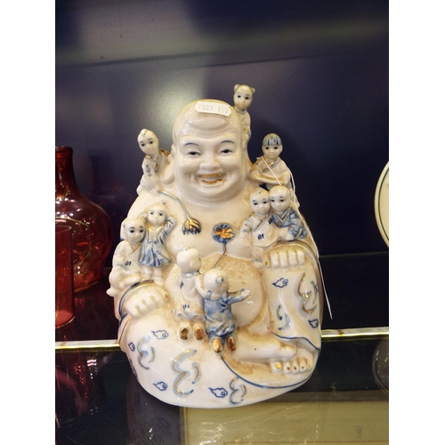 43 - A large Leonardo Collection blue and white Buddha and children