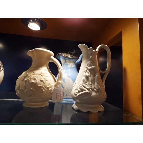 58 - Three Samuel Alcock Parian ware water jugs to include 'Ivy', 'Naomi and the Daughters in Law' etc