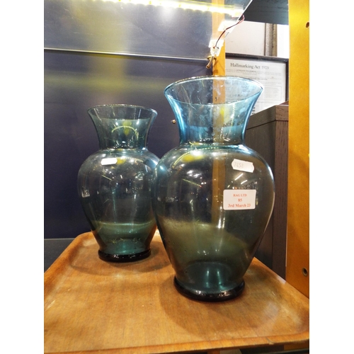 85 - A pair of blue glass vases