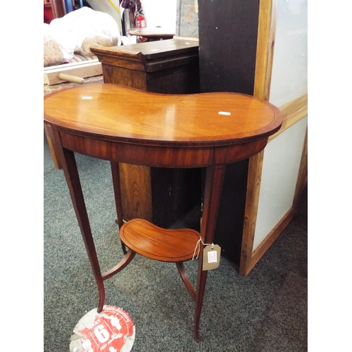 586 - A mahogany cross banded kidney shaped two tiered side table