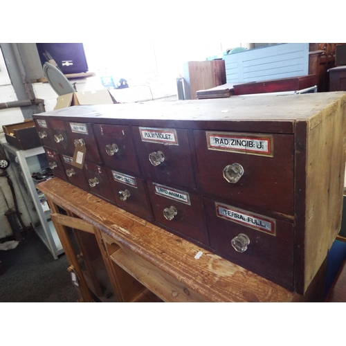 590 - A Victorian twelve drawer apothecary cabinet with glass handles