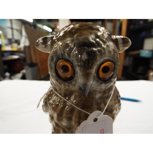 53 - A porcelain model of an owl with glass eyes with blue mark to base together with a blue and white me... 