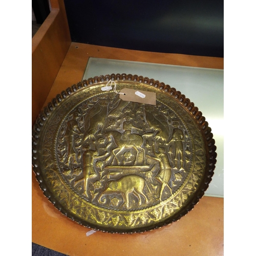 93 - A Victorian brass Indian tray having raised figural, animal and bird decoration