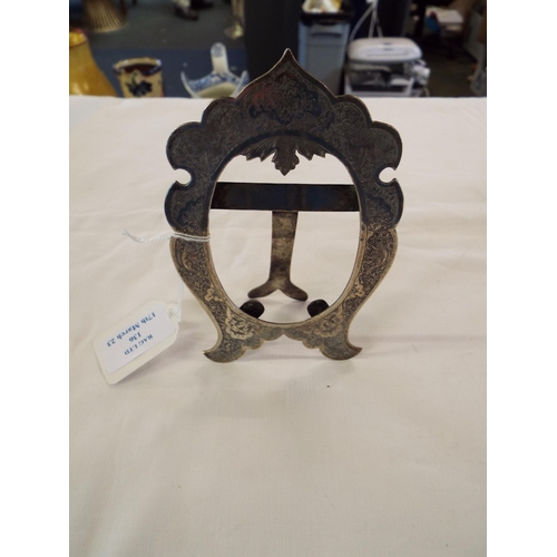 136 - An Indian silver photo frame having engine turned floral and bird decoration, makers mark to rear