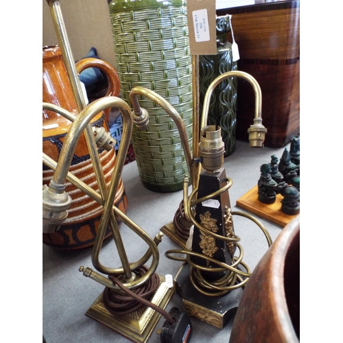 250 - Two ornate brass table lamps and a wooden example