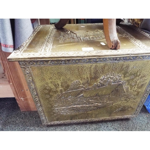 315 - A vintage embossed brass log box