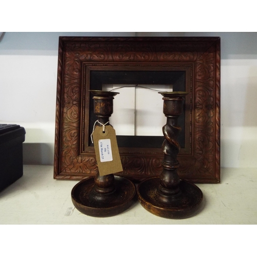 356 - A pair of vintage barley twist candlesticks together with a carved wooden picture frame