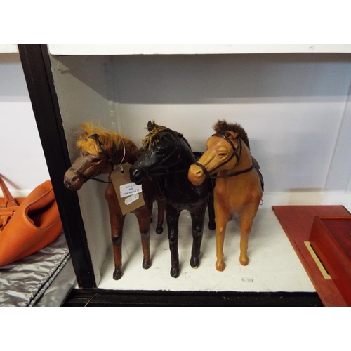 360 - Three leather horses