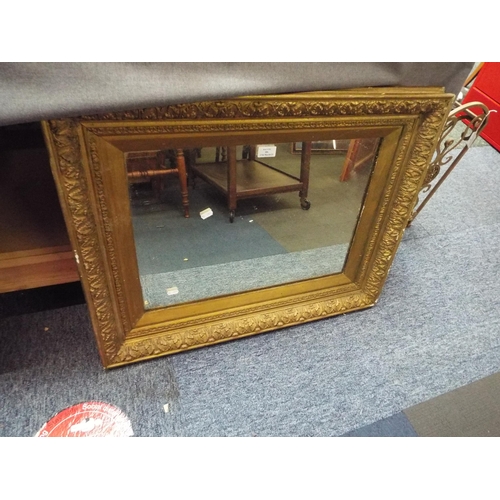 406 - A heavy gilt framed mirror