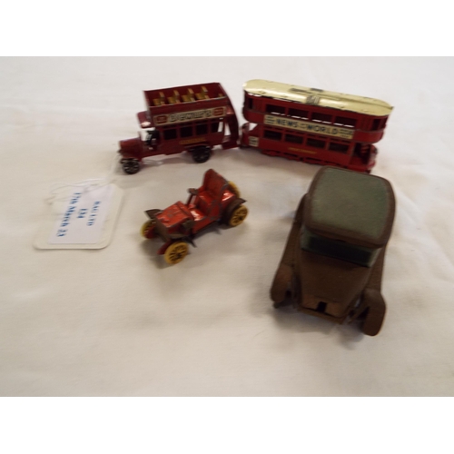 134 - A vintage tin plate car together with two Lesney die-cast buses and another